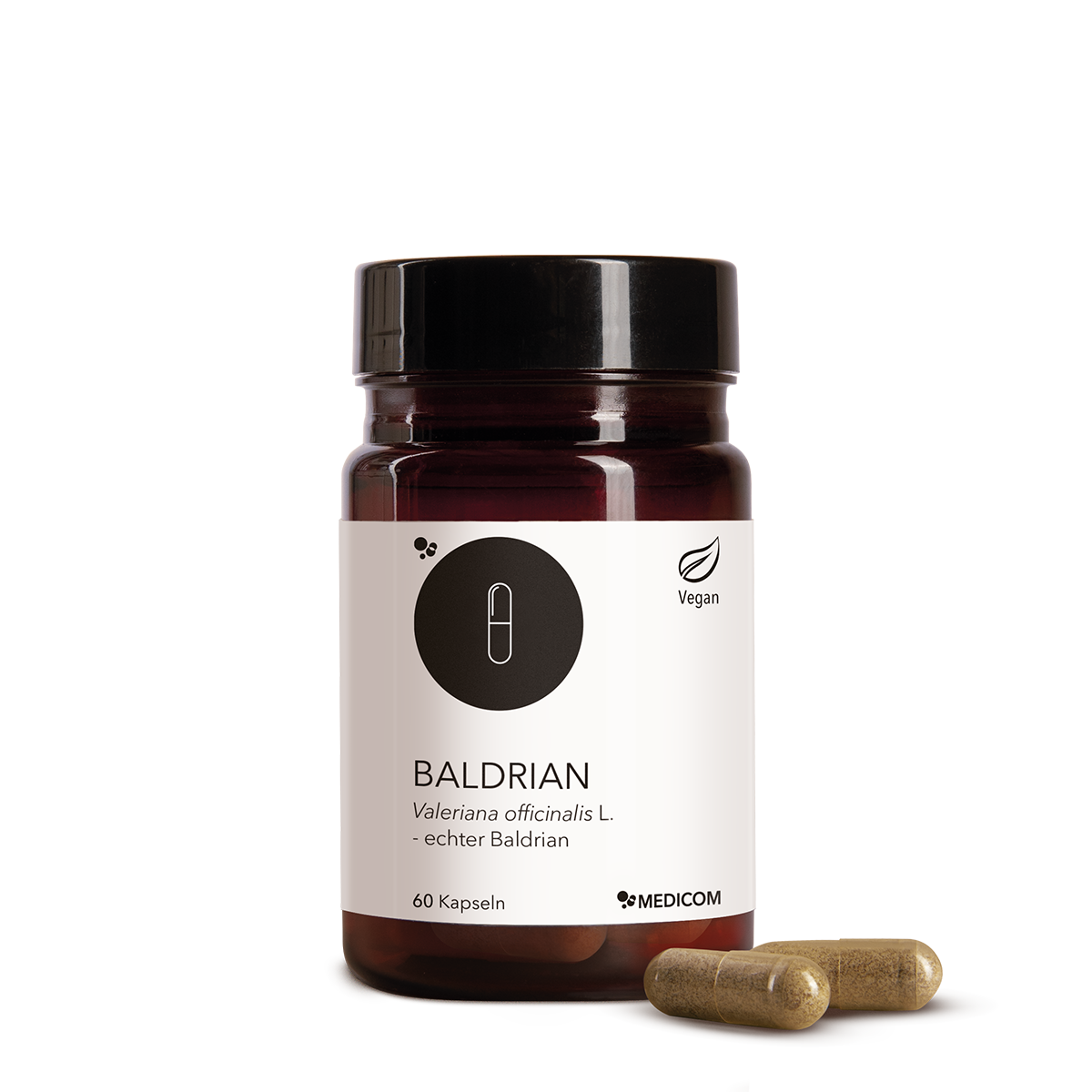 Die Produktdose von Baldrian mit zwei Kapseln im Vordergrund