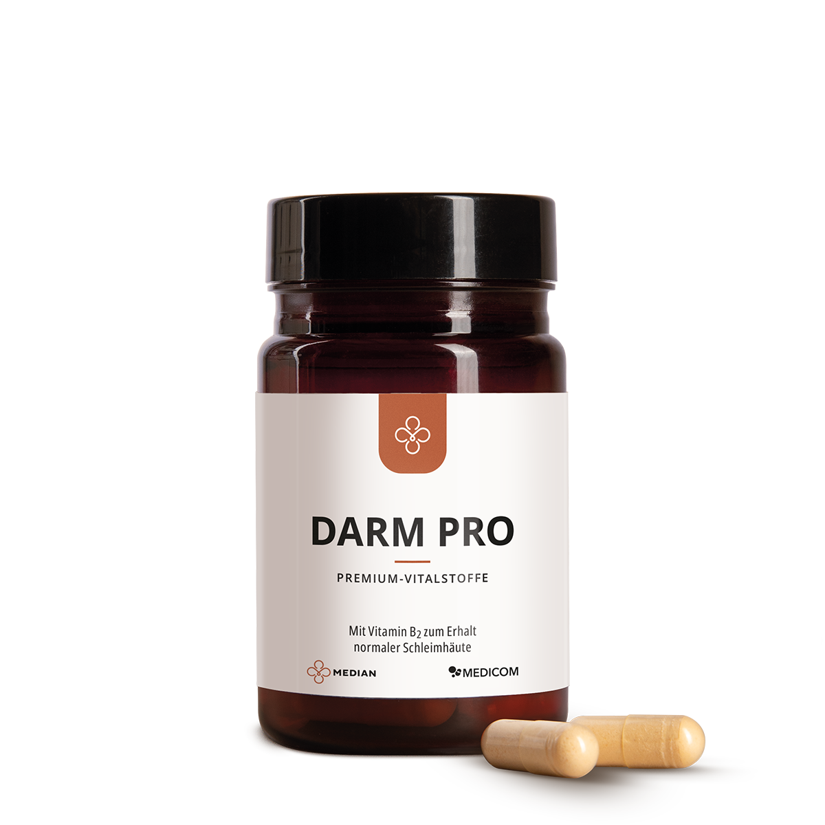 Eine braune Dose mit der Aufschrift Median Darm Pro von Medicom mit zwei beigen Kapseln, die Bakterienkulturen und Vitamin B2 enthalten, ist daneben auf einem weißen Hintergrund abgebildet.