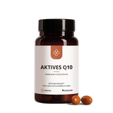 Eine braune Flasche mit der Aufschrift "Median Aktives Q10" von Medicom, die hochwertiges Kaneka Ubiquinol enthält, wird mit drei braunen Kapseln daneben auf einem weißen Hintergrund gezeigt.