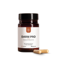 Eine braune Dose mit der Aufschrift Median Darm Pro von Medicom mit zwei beigen Kapseln, die Bakterienkulturen und Vitamin B2 enthalten, ist daneben auf einem weißen Hintergrund abgebildet.