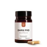 Eine braune Dose mit der Aufschrift Median Darm Pro von Medicom mit zwei beigen Kapseln, die Bakterienkulturen und Vitamin B2 enthalten, ist daneben auf einem weißen Hintergrund abgebildet.