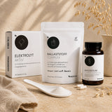 Das GLP-1-Begleitset "Darm in Bewegung" von Medicom mit drei Produkten von Medicom: Elektrolyt Aktiv (Pulver), Ballaststoff Complex (Pulver) und Magnesium Citrat Kapseln.