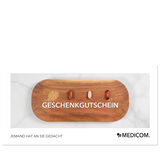 Ein Holztablett mit verschiedenen Kapseln