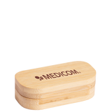 Rectangular Kapselbox aus Bambus with rounded edges, featuring the MEDICOM logo printed on top.