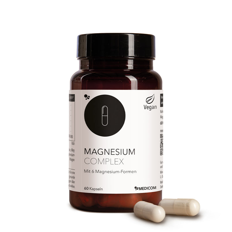 Die Produktdose von Magnesium Complex mit sechs verschiedenen Magnesium-Formen und zwei Kapseln im Vordergrund