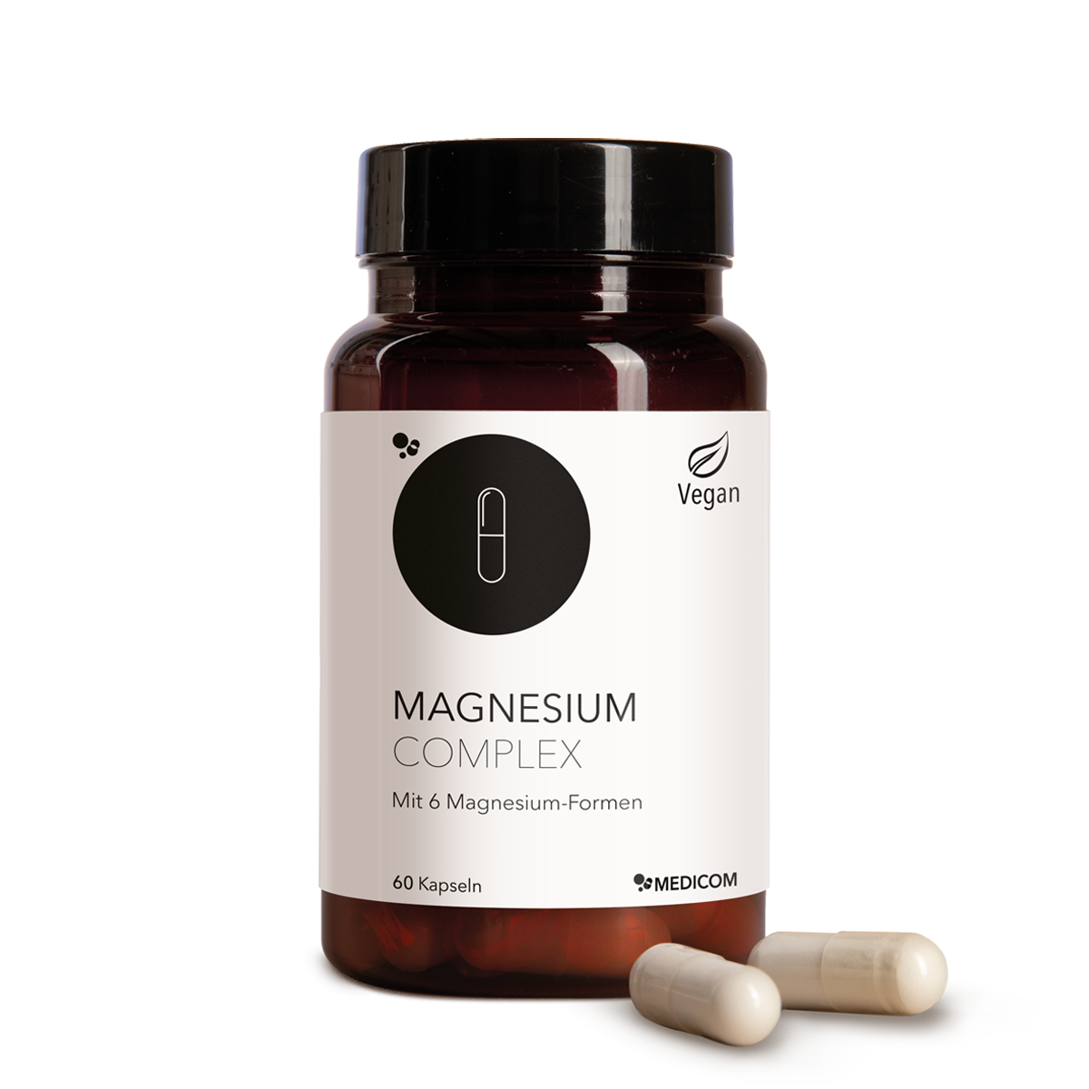 Die Produktdose von Magnesium Complex mit sechs verschiedenen Magnesium-Formen und zwei Kapseln im Vordergrund
