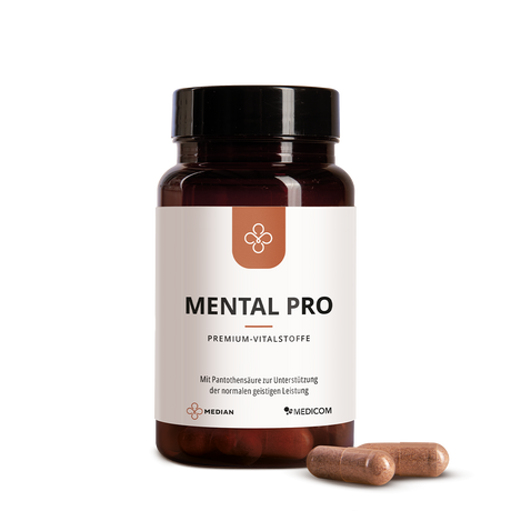 A brown pill bottle labeled Median Mental Pro with Lion’s Mane and CDP-Cholin, plus two brown capsules beside it on a white background, to support kognitive Leistung.
