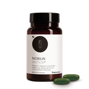 Die Produktdose von Nobilin Antiox® mit zwei grünen Soft-Gel-Kapseln im Vordergrund