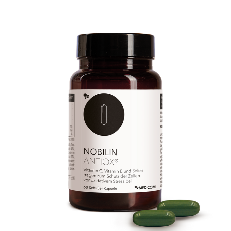 Die Produktdose von Nobilin Antiox® mit zwei grünen Soft-Gel-Kapseln im Vordergrund
