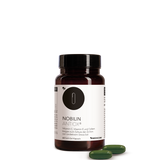 Die Produktdose von Nobilin Antiox® in der Vorderansicht mit zwei Soft-Gel-Kapseln davor