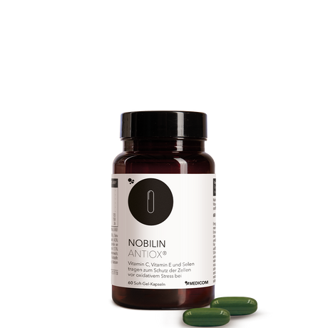 Die Produktdose von Nobilin Antiox® in der Vorderansicht mit zwei Soft-Gel-Kapseln davor