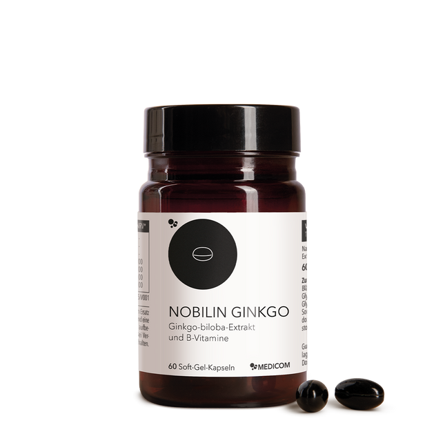 Die Produktdose von Nobilin Ginkgo von Medicom mit zwei Kapseln im Vordergrund.