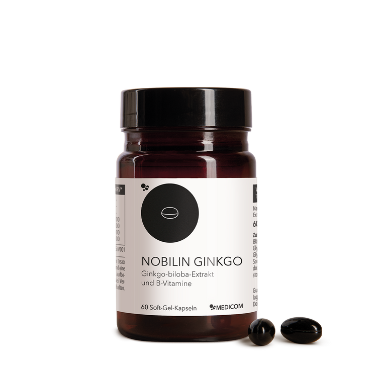 Die Produktdose von Nobilin Ginkgo von Medicom mit zwei Kapseln im Vordergrund.