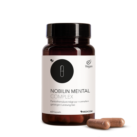 Die Produktdose von Nobilin Mental Complex mit zwei Kapseln im Vordergrund