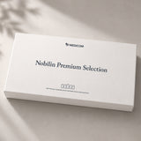 Rechteckige, weiße Medicom Nobilin Premium Selection Gold-Produktverpackung, ideal zum Verschenken.