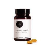 Eine Flasche Medicom Vitamin-B-Komplex mit zwei gelben Kapseln daneben auf weißem Hintergrund – für ein gesundes Nervensystem.