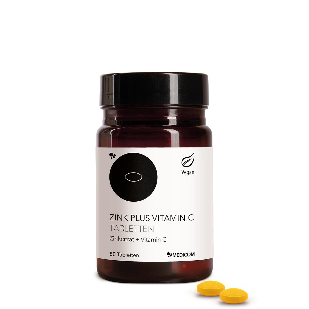 Die Zink Plus Vitamin C Tabletten  in der stilvollen Produktdose von Medicom – Zinkcitrat und Vitamin C. Zwei Tabletten im Vordergrund