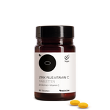 Die Zink Plus Vitamin C Tabletten  in der stilvollen Produktdose von Medicom – Zinkcitrat und Vitamin C. Zwei Tabletten im Vordergrund