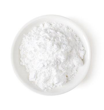 Calcium Tabletten 400 mg weißes Pulver von oben fotografiert